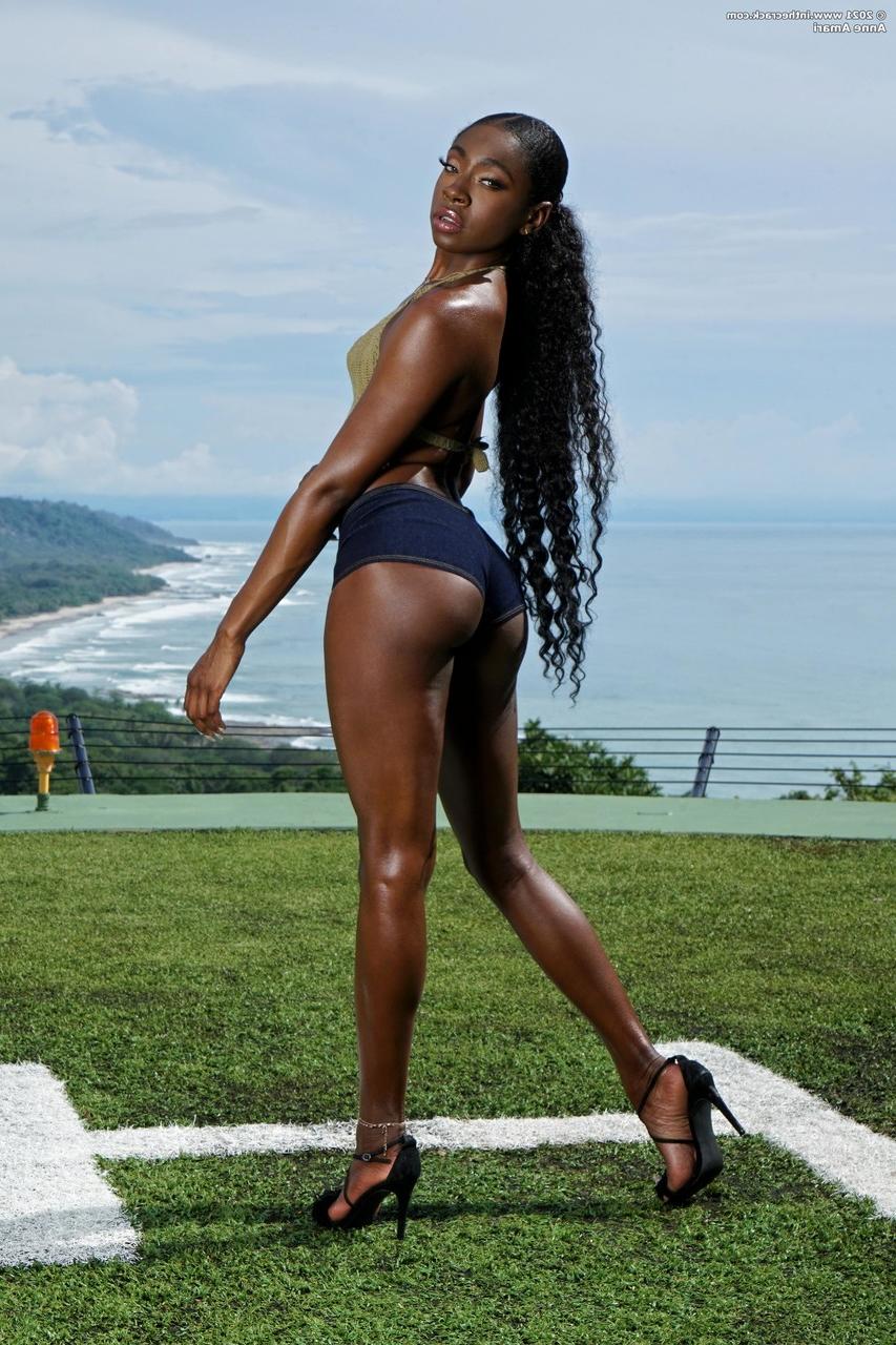 20P Hot ebony model Anne Amari shows off her big ass & toys her shaved pussy