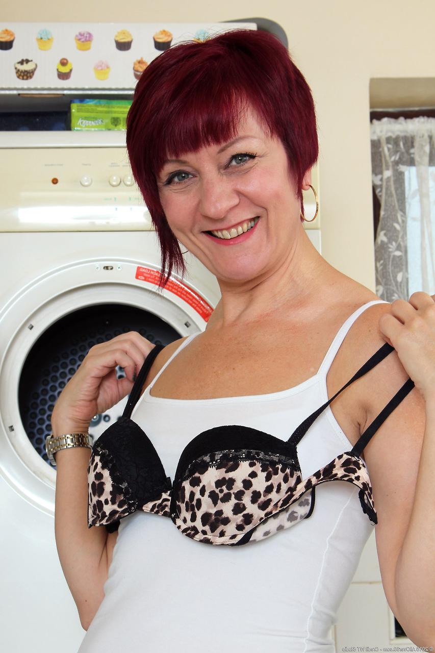 20P Slutty MILF Penny Brooks strips & spreads her pussy while doing housework