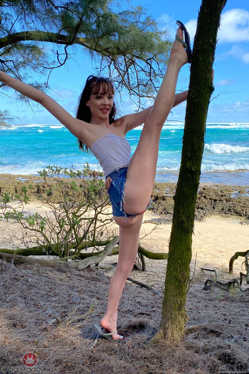 20P Slim cutie Aliya Brynn spreads her legs and flashes her pussy outdoors