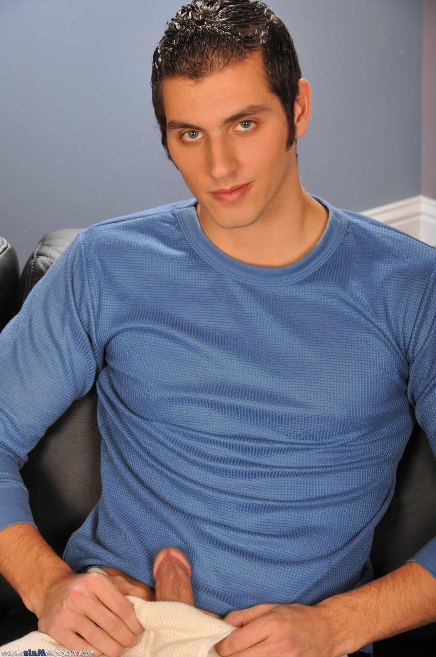 20P Handsome stallion Rocky Touch pulls out his hard cock and wanks it