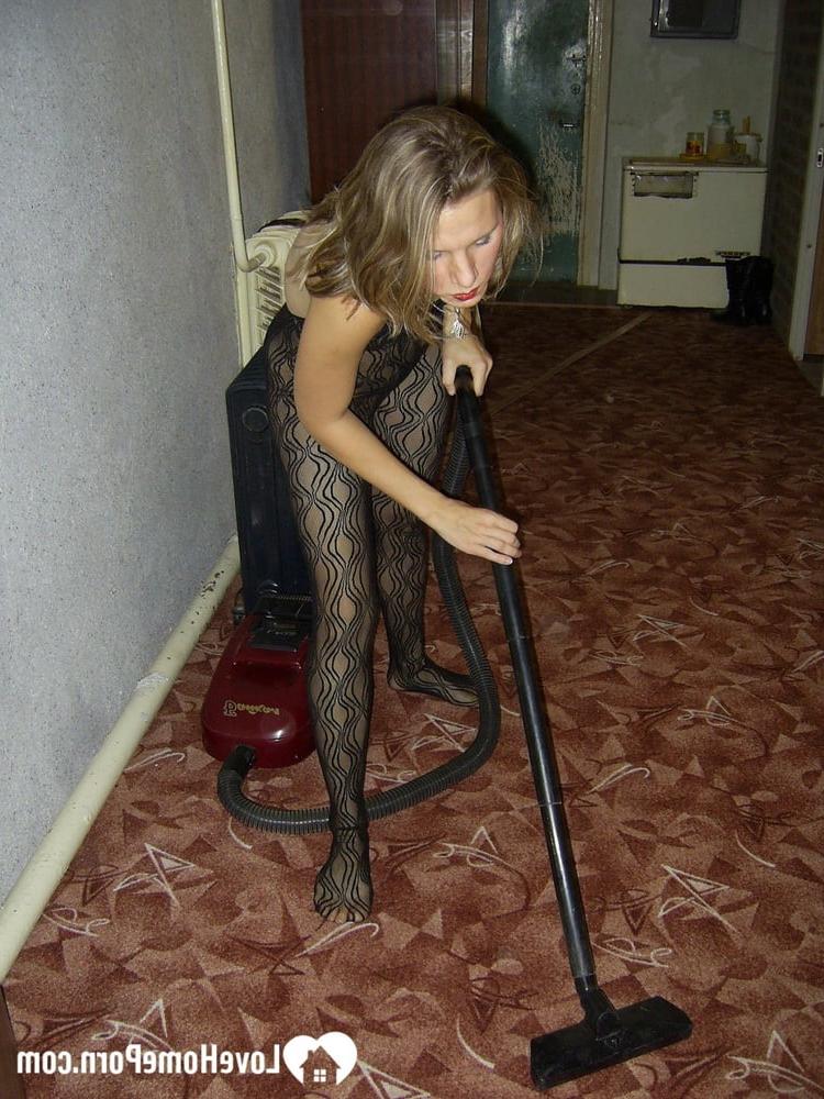 20P Slutty housewife with red lipstick poses in her bodystocking while vacuuming