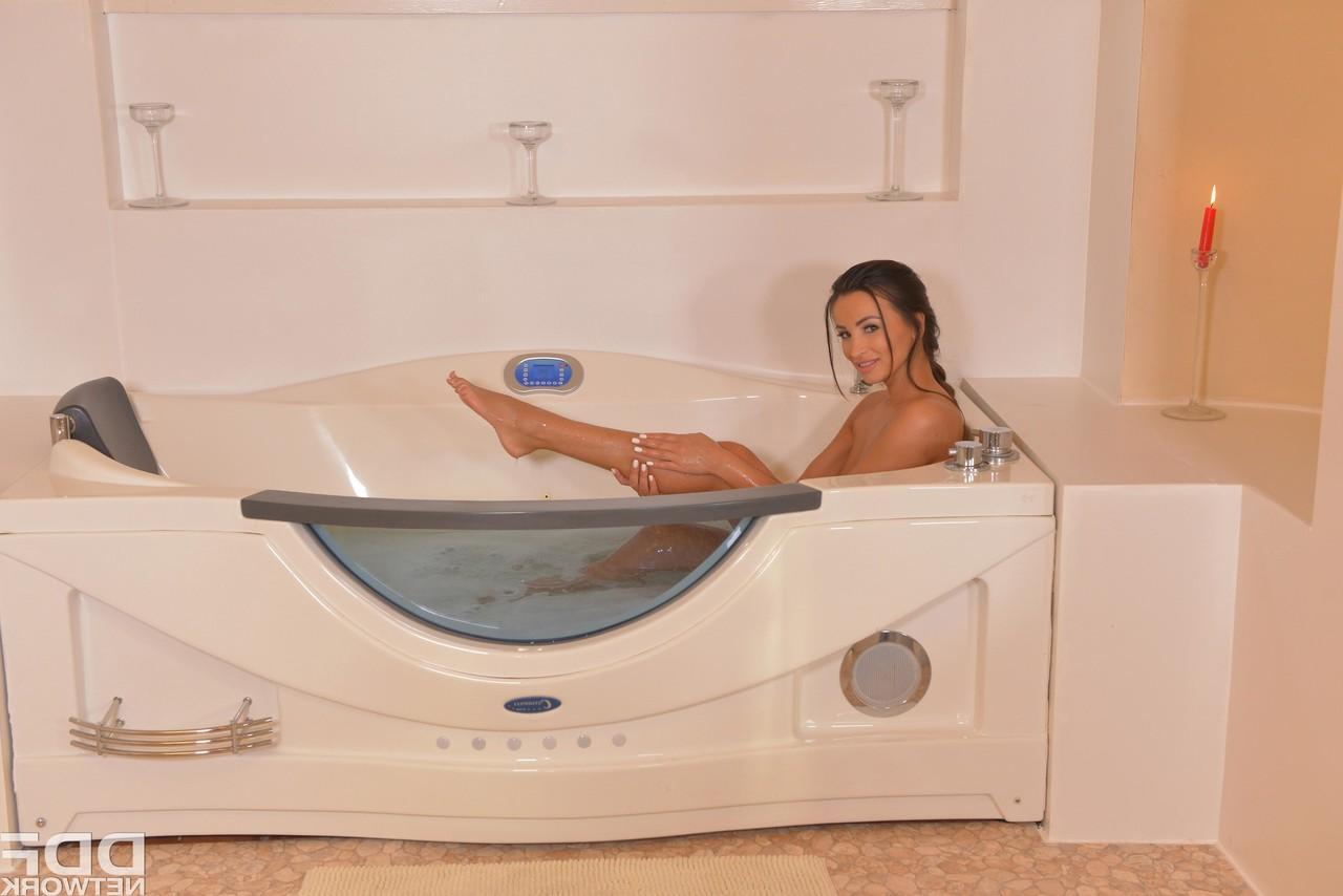 17P Astounding ladies Aislin and Alyssia Kent have fun with strapon in bathtub