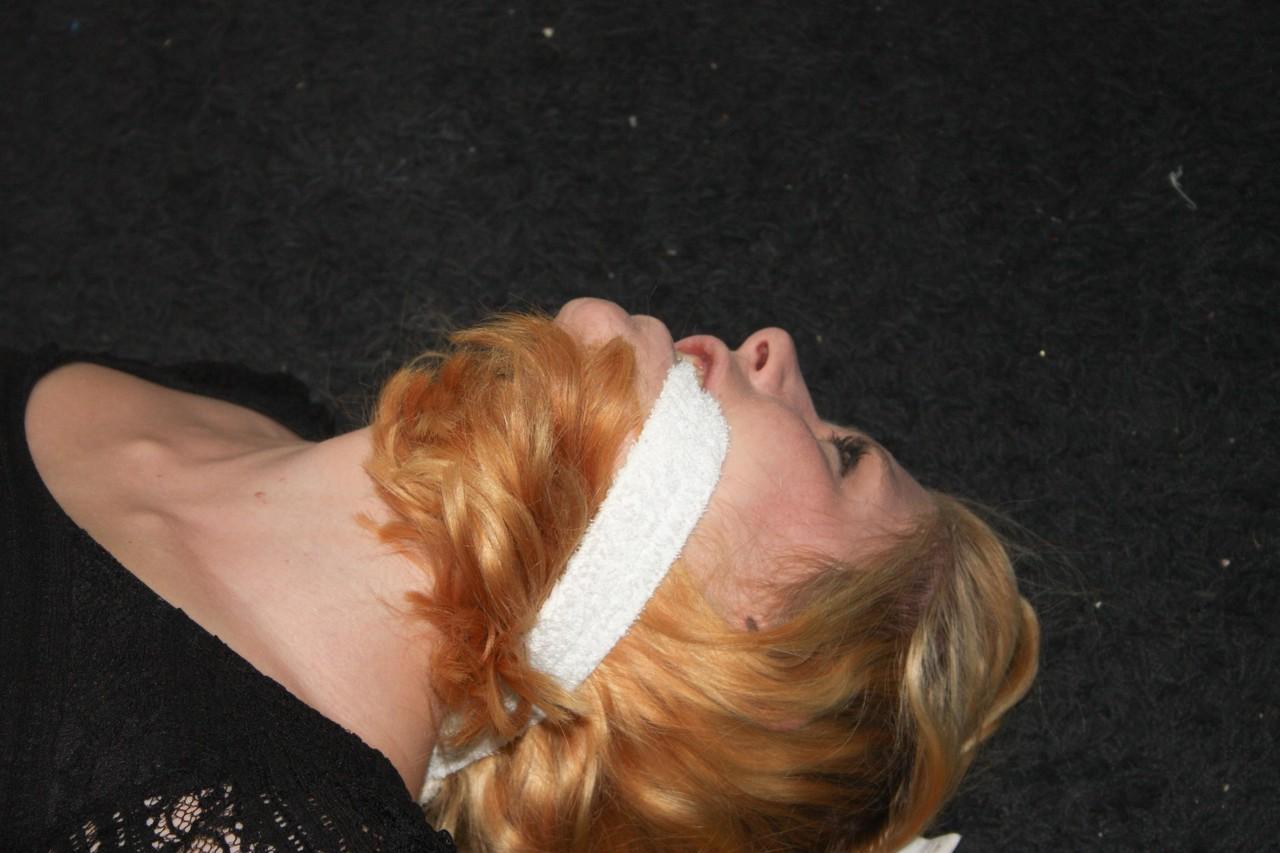20P Fully clothed babe Cindy struggles helplessly while hogtied on the floor