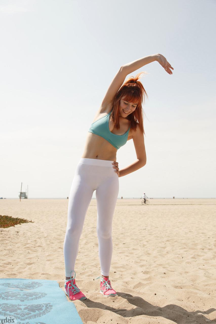 12P Sexy redhead Penelope Lynn teases operator while doing yoga on beach