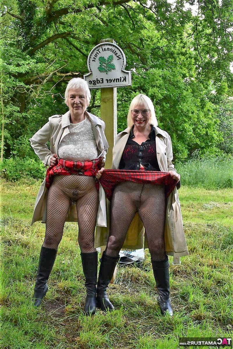 16P Barby Slut and a girlfriend flashe in a public park while wearing black boots