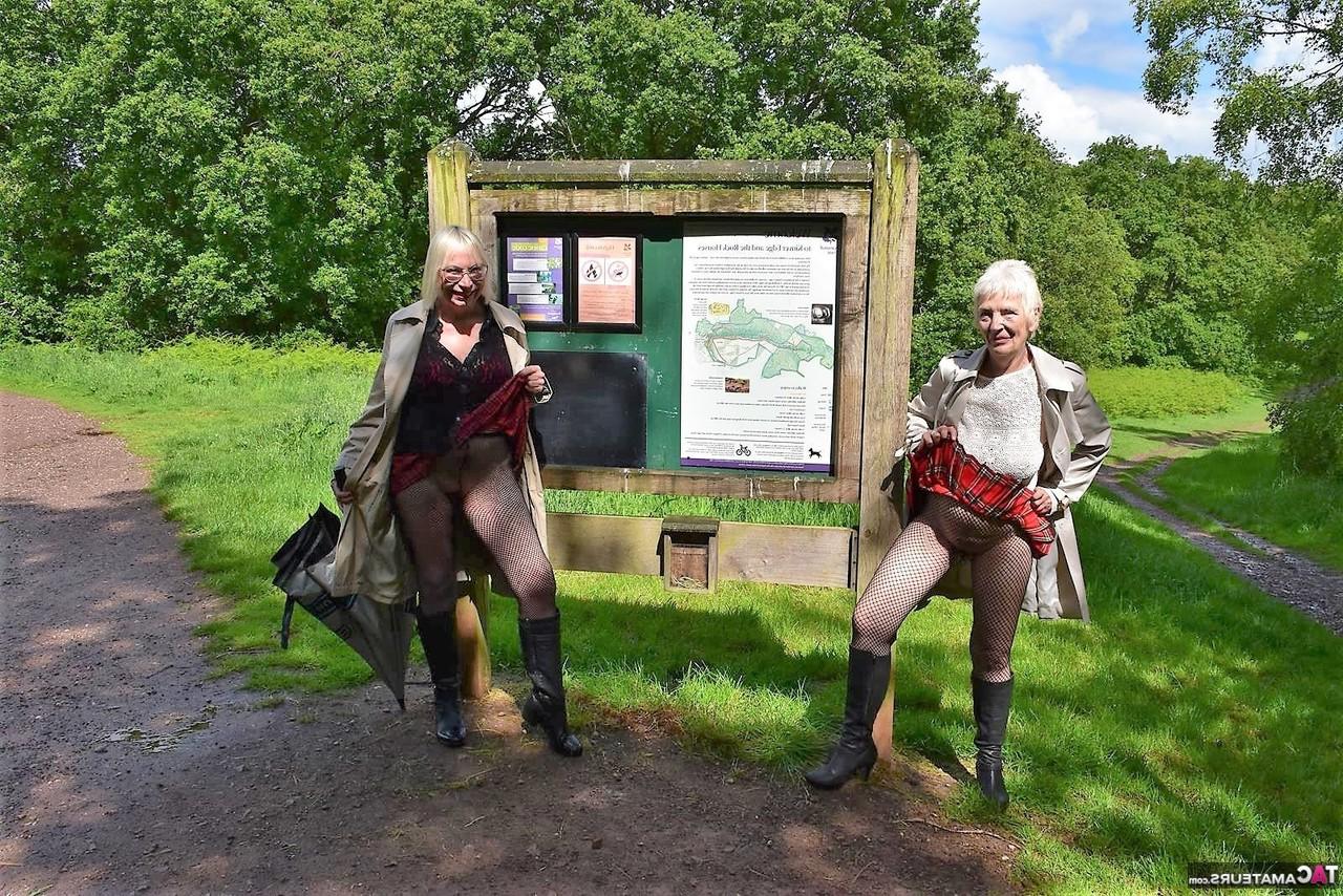 16P Barby Slut and a girlfriend flashe in a public park while wearing black boots