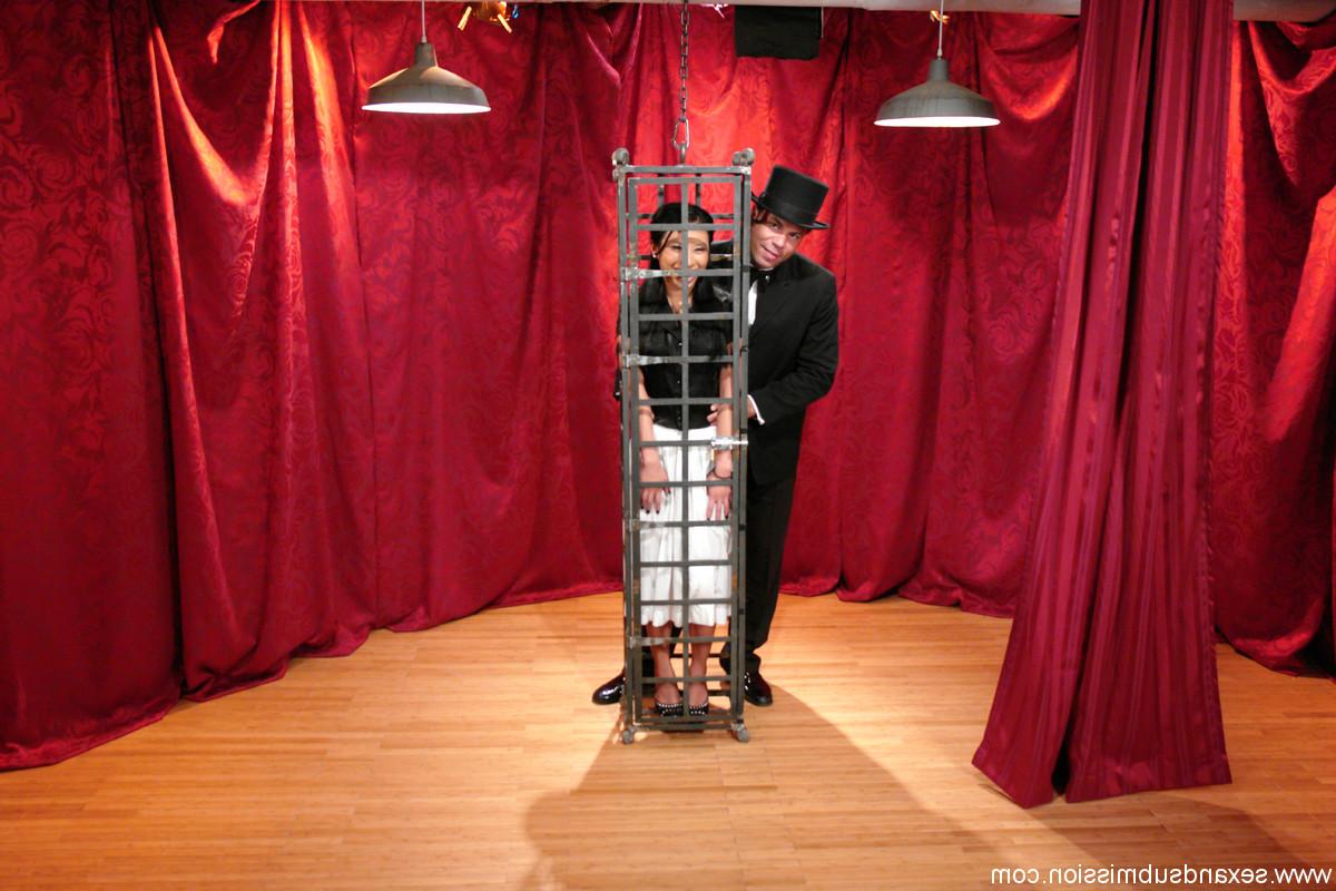 20P Skinny Asian Soolin Kelter gets caged during a magician's performance