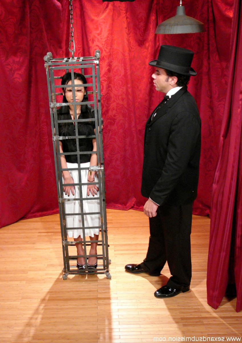 20P Skinny Asian Soolin Kelter gets caged during a magician's performance