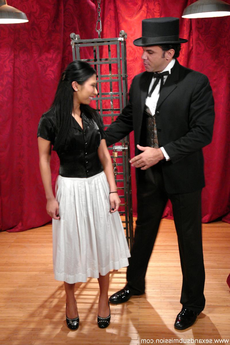 20P Skinny Asian Soolin Kelter gets caged during a magician's performance