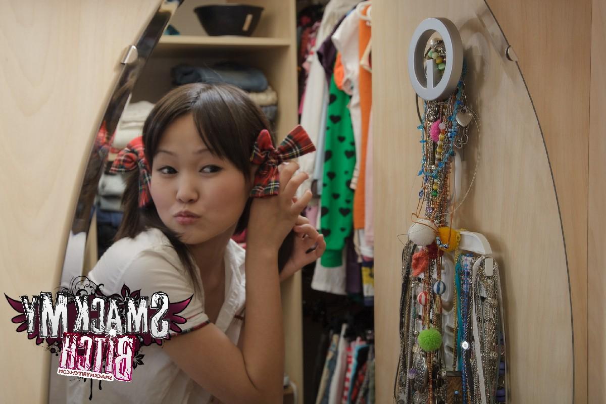 15P Young looking Asian student Aliona goes nude while putting in pigtails
