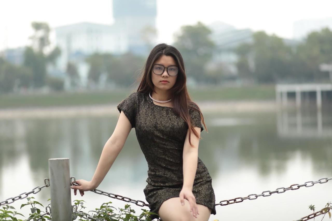 20P Nerdy Asian babe Natalia posing in her sexy black dress in public