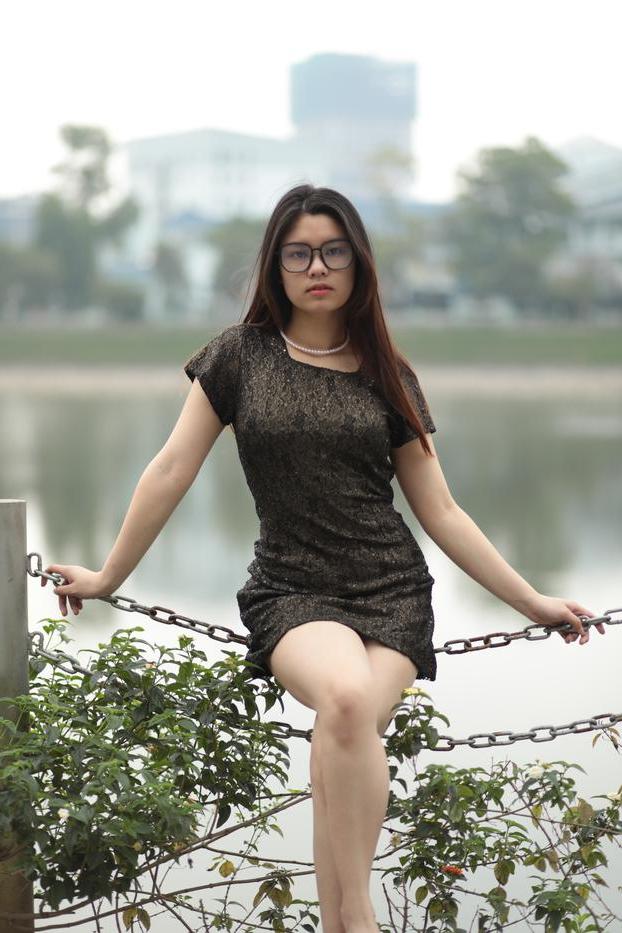 20P Nerdy Asian babe Natalia posing in her sexy black dress in public