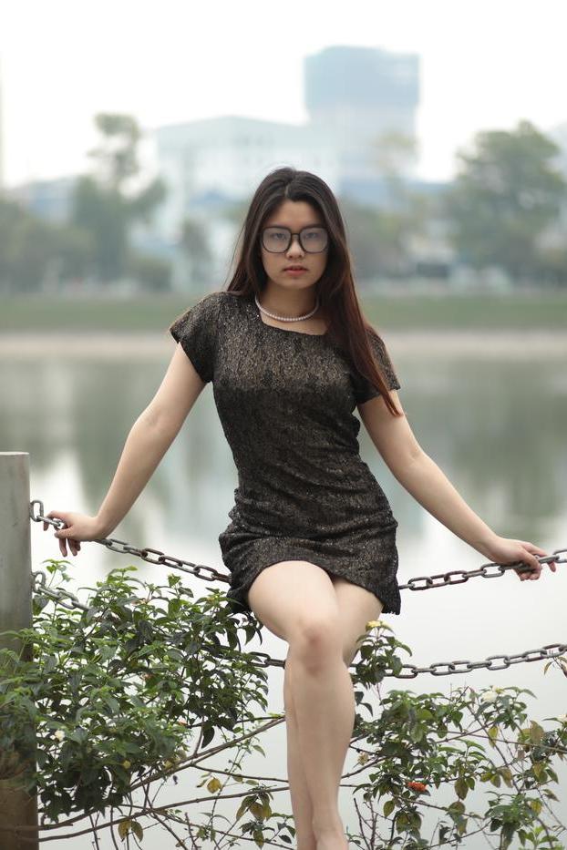 20P Nerdy Asian babe Natalia posing in her sexy black dress in public