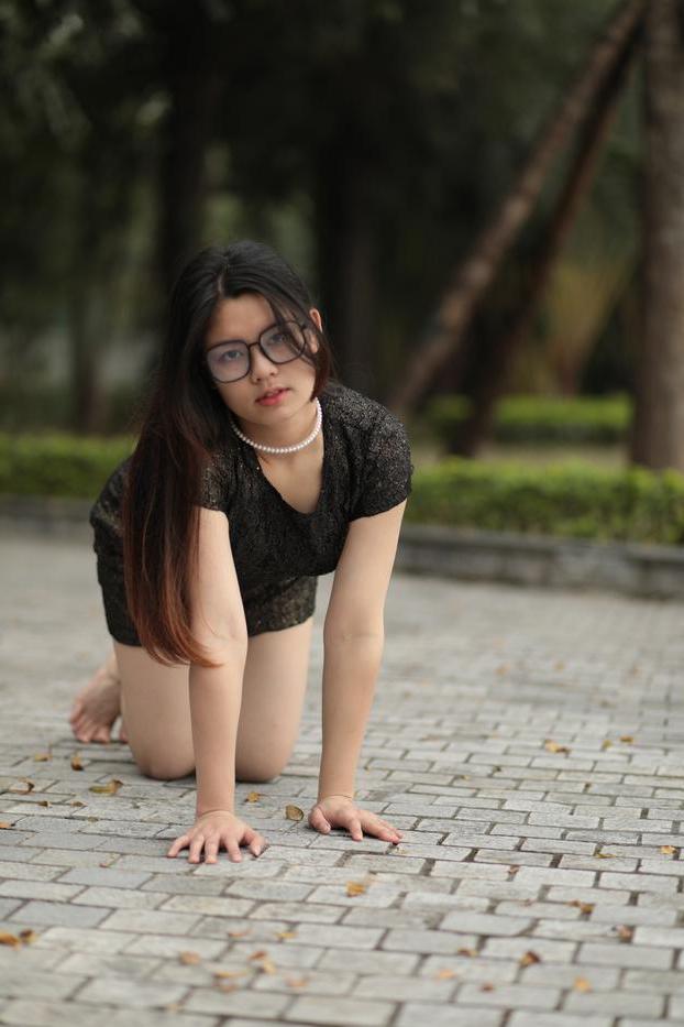 20P Nerdy Asian babe Natalia posing in her sexy black dress in public