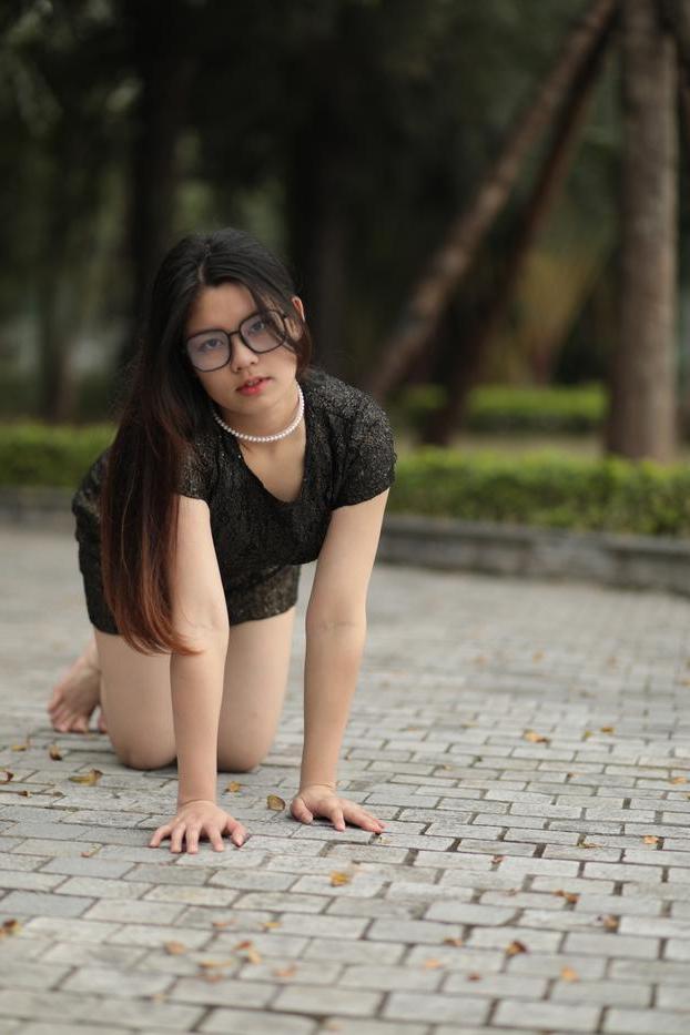 20P Nerdy Asian babe Natalia posing in her sexy black dress in public
