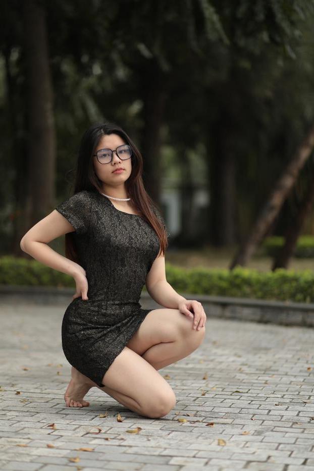 20P Nerdy Asian babe Natalia posing in her sexy black dress in public