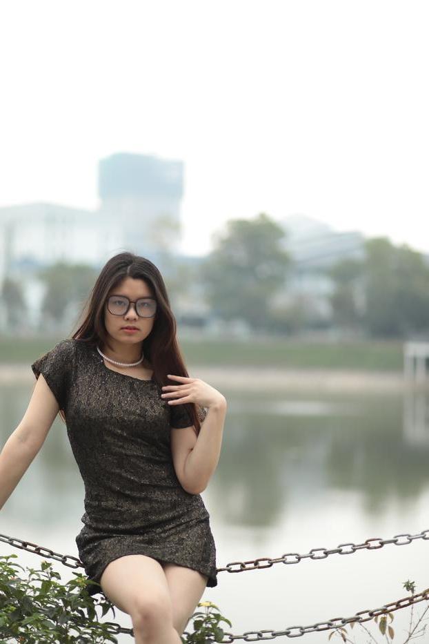 20P Nerdy Asian babe Natalia posing in her sexy black dress in public