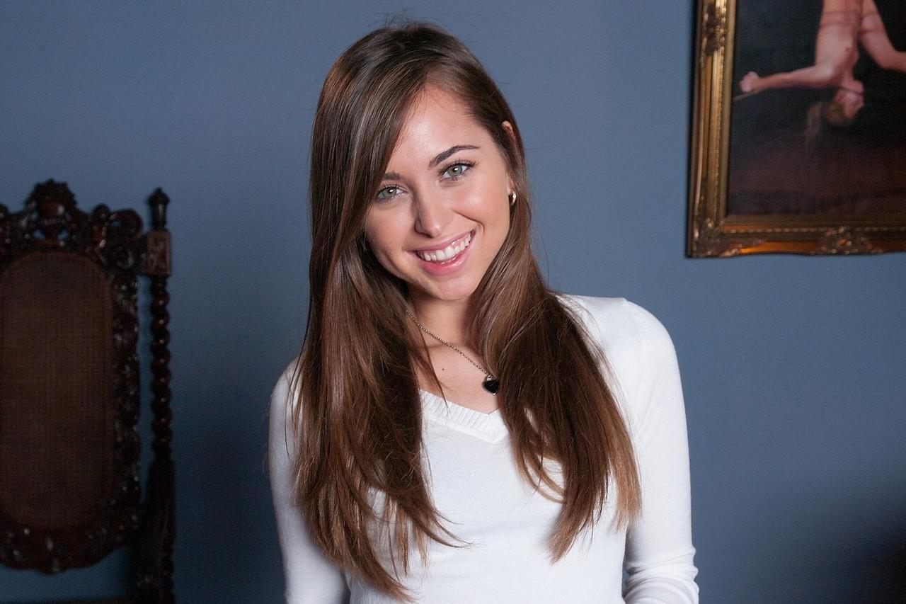20P Petite doll Riley Reid strips in front of her piano and poses nude