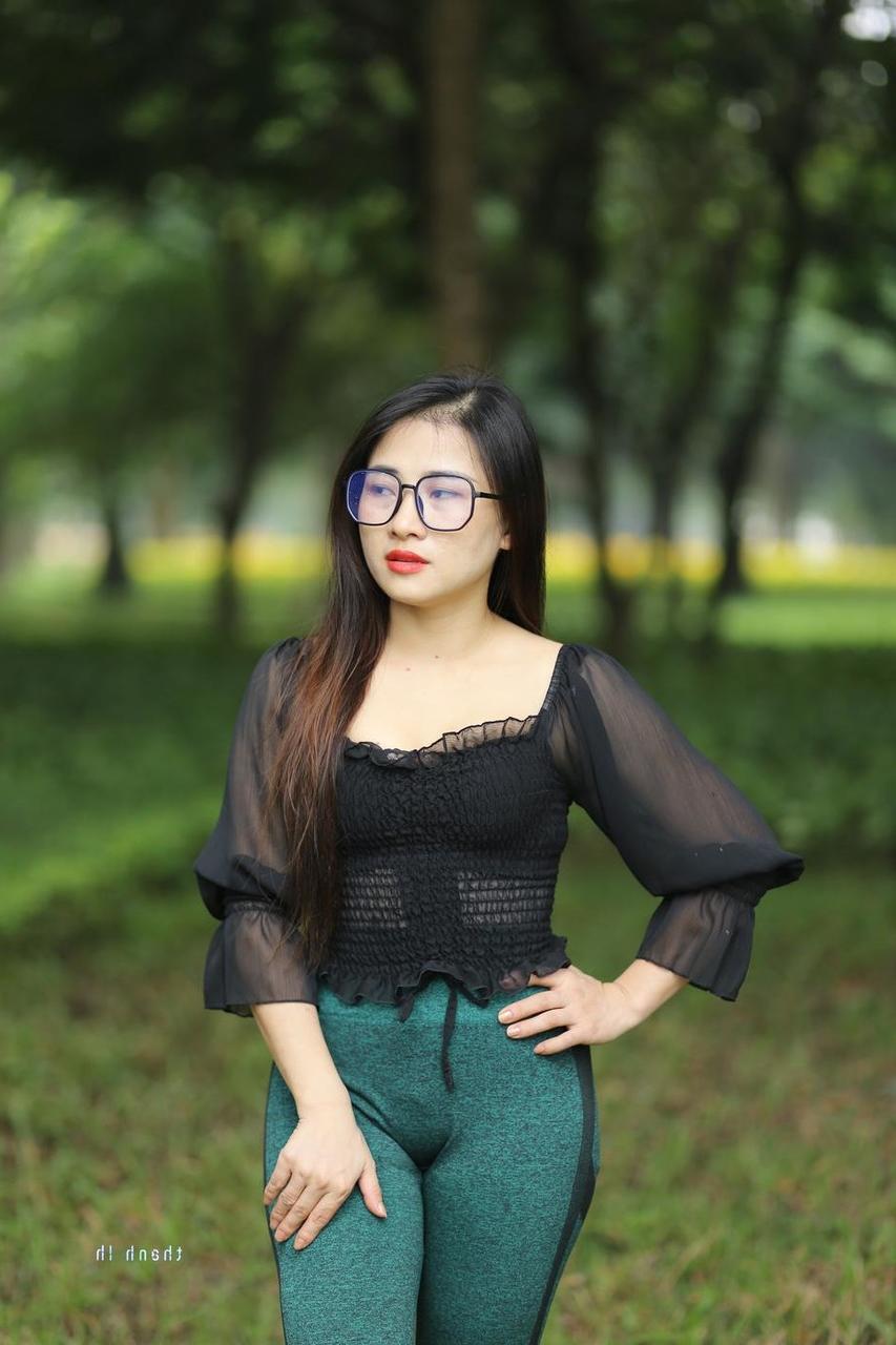 20P Pretty Asian model with glasses Elena poses in her hot blouse and pants