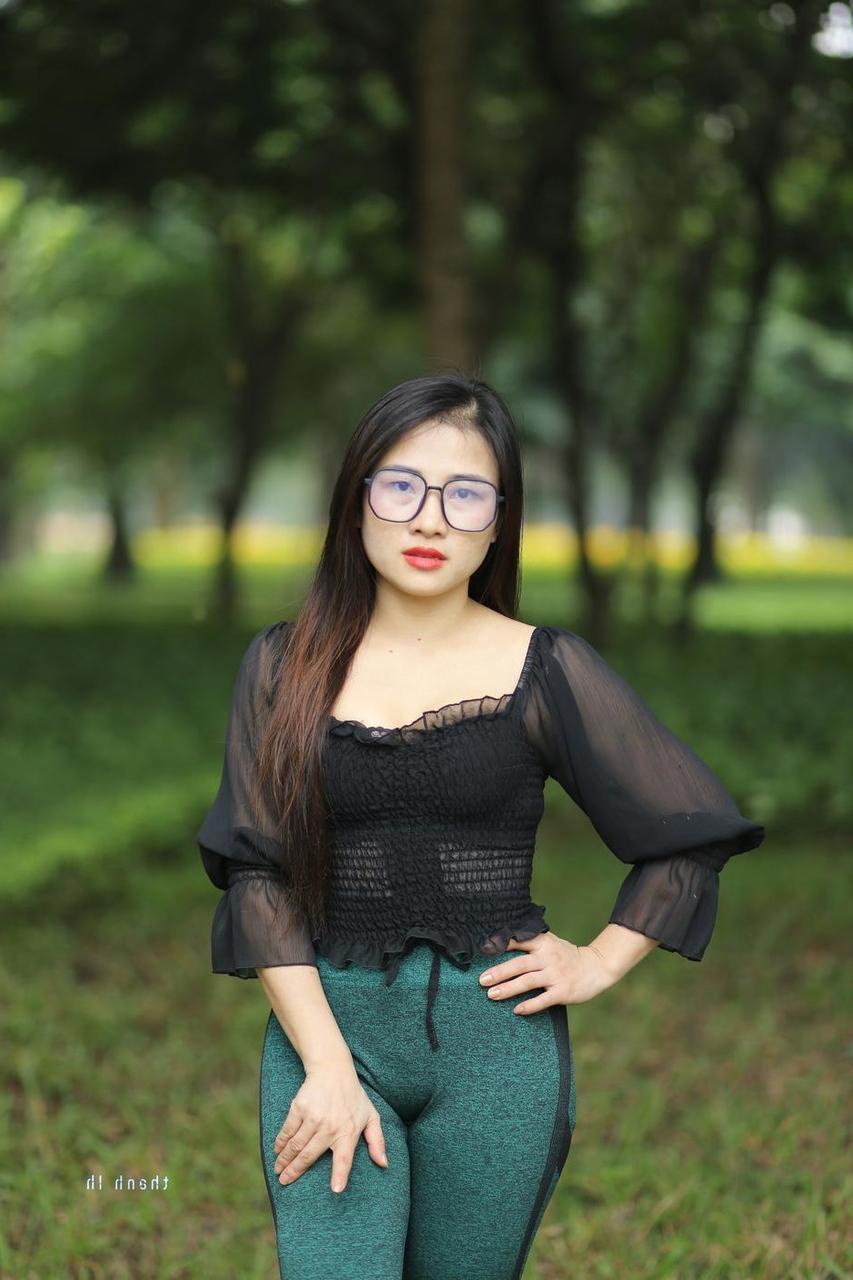 20P Pretty Asian model with glasses Elena poses in her hot blouse and pants