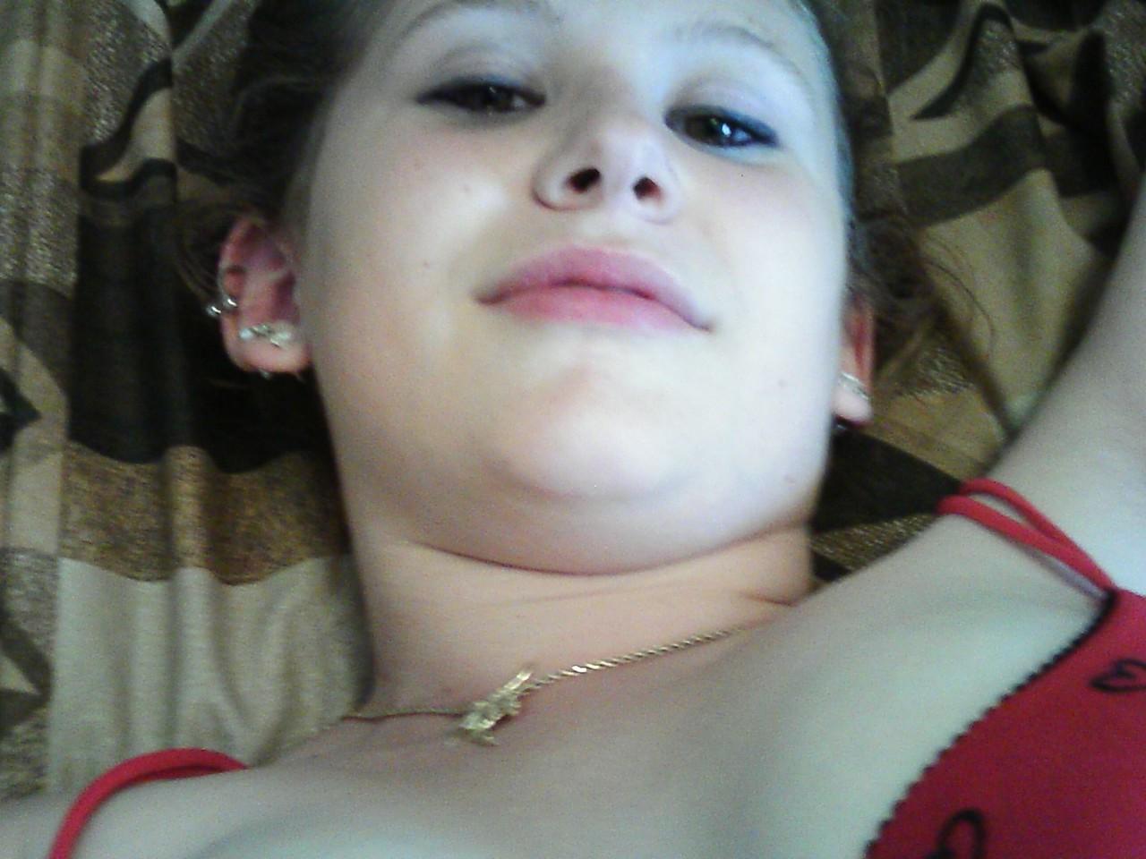 20P Young amateur teases with her juicy tits in a bra while taking some selfies