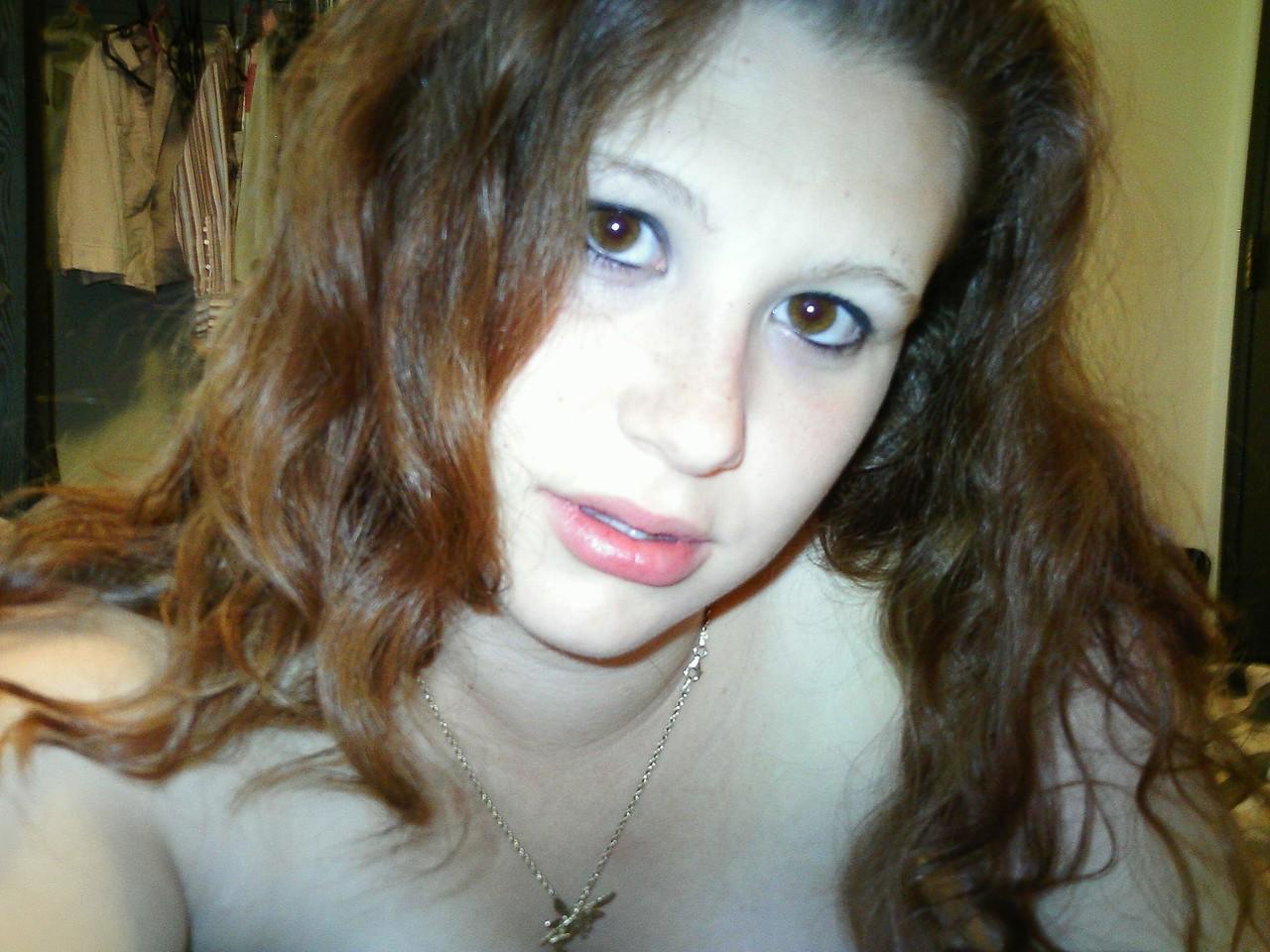 20P Young amateur teases with her juicy tits in a bra while taking some selfies