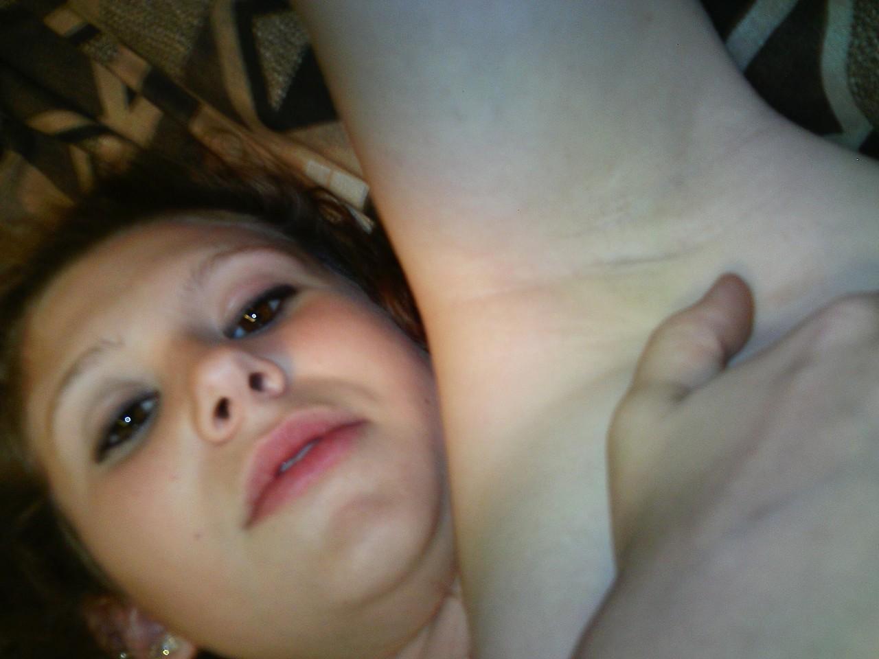 20P Young amateur teases with her juicy tits in a bra while taking some selfies