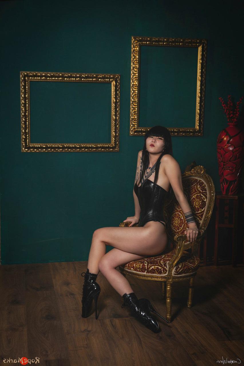 16P Asian solo model Flawless Meow poses in a leather corset and high heels