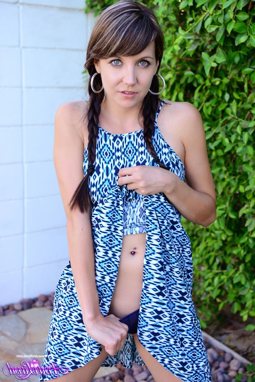 15P Teen amateur Andi Land tugs on her pigtails before getting totally naked