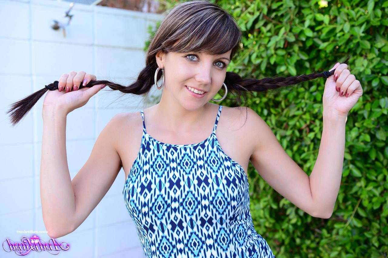 15P Teen amateur Andi Land tugs on her pigtails before getting totally naked