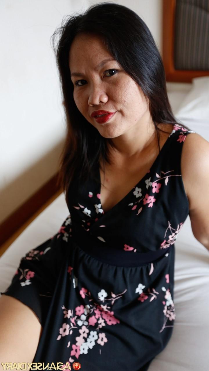20P Asian MILF Arif shows her shaved pussy up close after enjoying a big dick
