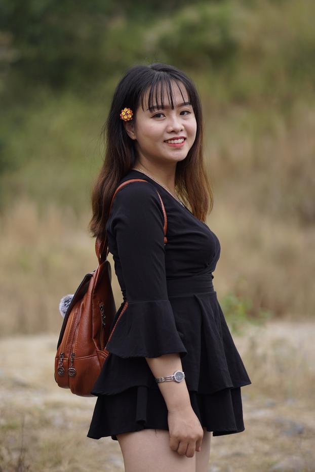 20P Gorgeous Asian babe posing in her black dress and boots in nature