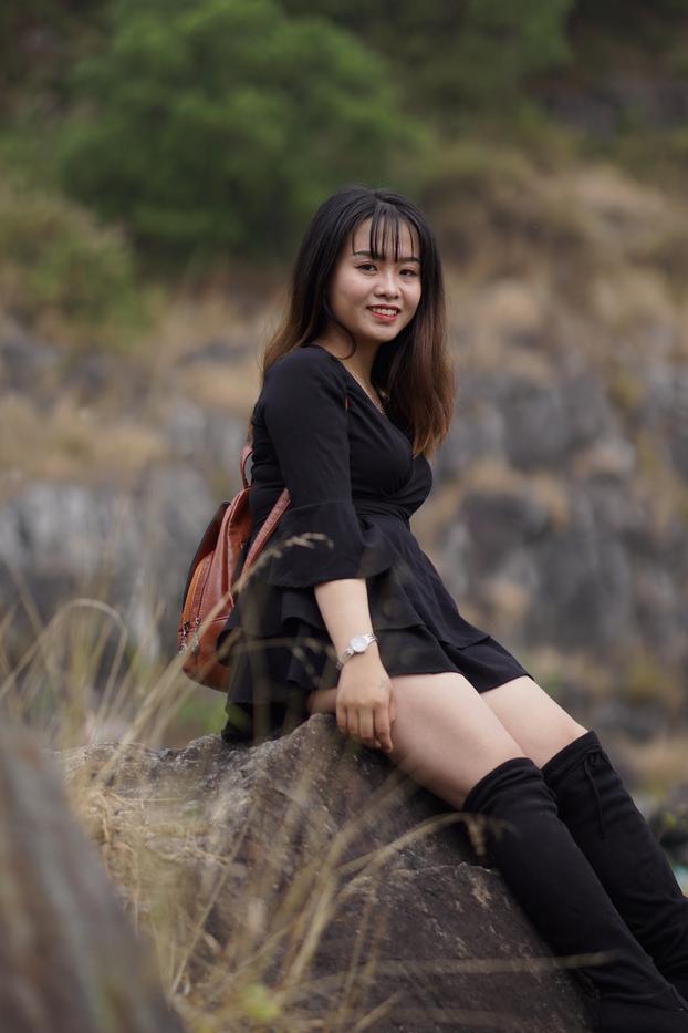 20P Gorgeous Asian babe posing in her black dress and boots in nature