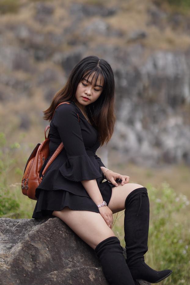 20P Gorgeous Asian babe posing in her black dress and boots in nature
