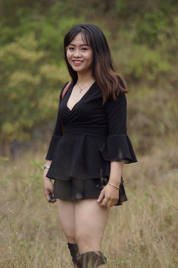 20P Gorgeous Asian babe posing in her black dress and boots in nature