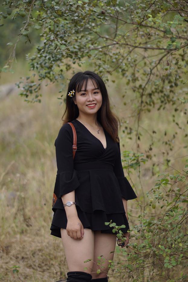 20P Gorgeous Asian babe posing in her black dress and boots in nature