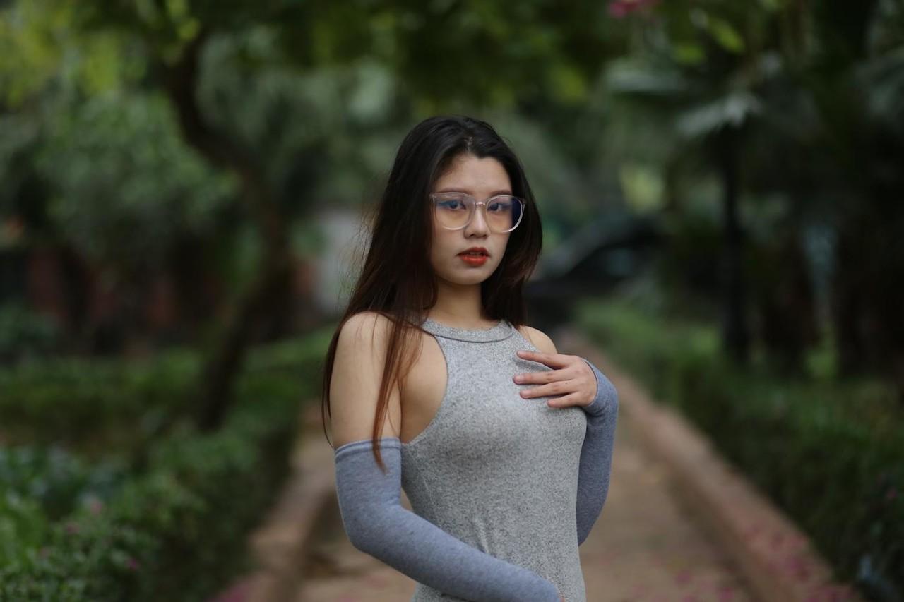 20P Slutty Asian babe with glasses Natalia posing in her provocative outfit