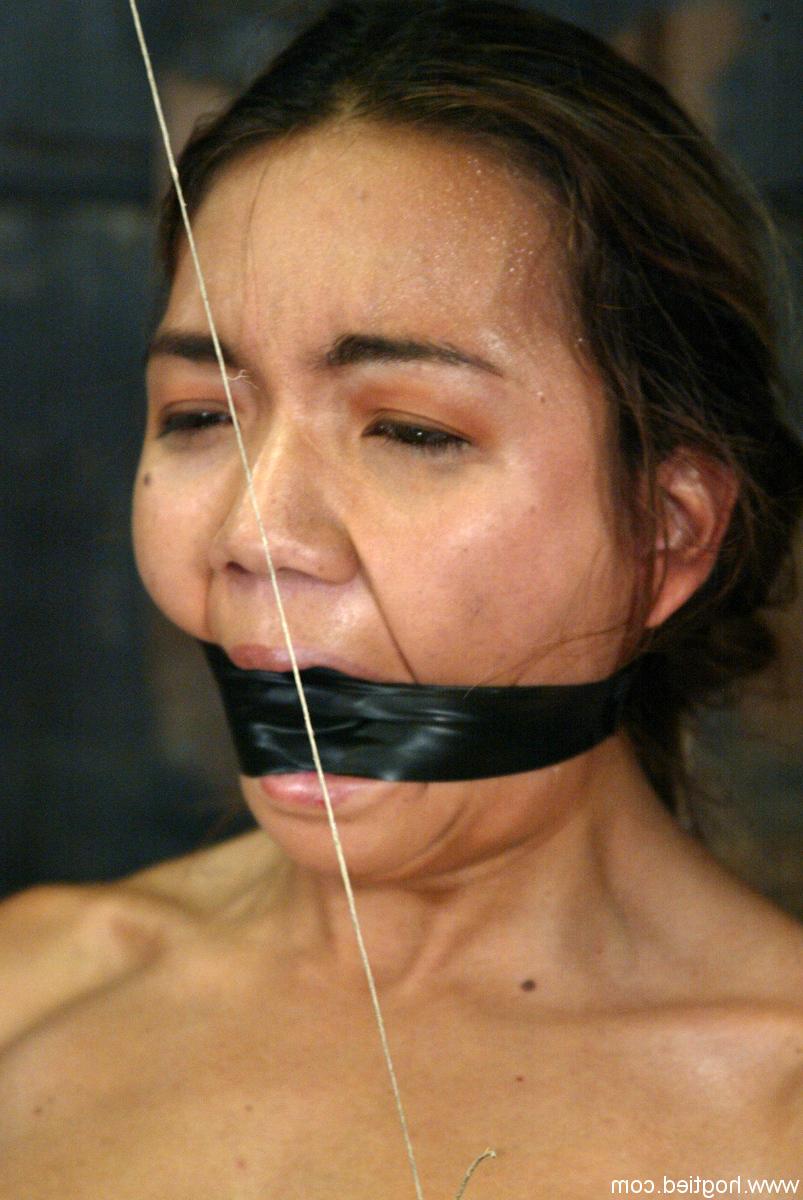 20P Submissive Asian babe Keeani Lei gets bound and toyed by a dom in a dungeon