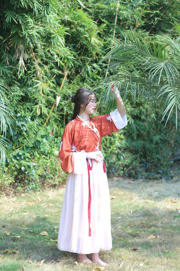 20P Glamorous Asian girl posing in her traditional Chinese outfit in nature
