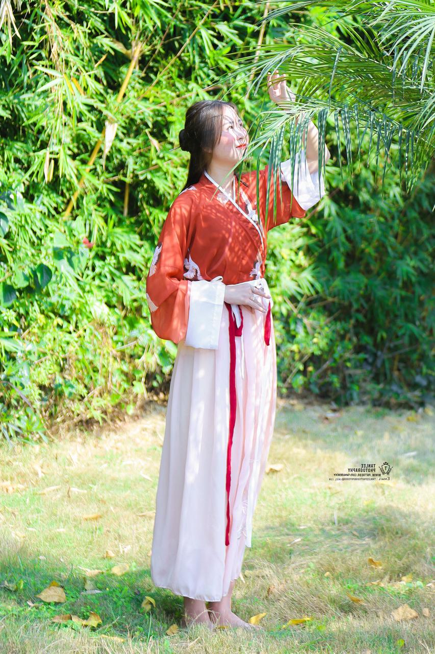 20P Glamorous Asian girl posing in her traditional Chinese outfit in nature