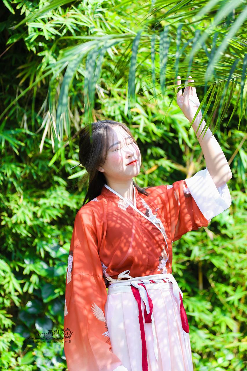 20P Glamorous Asian girl posing in her traditional Chinese outfit in nature