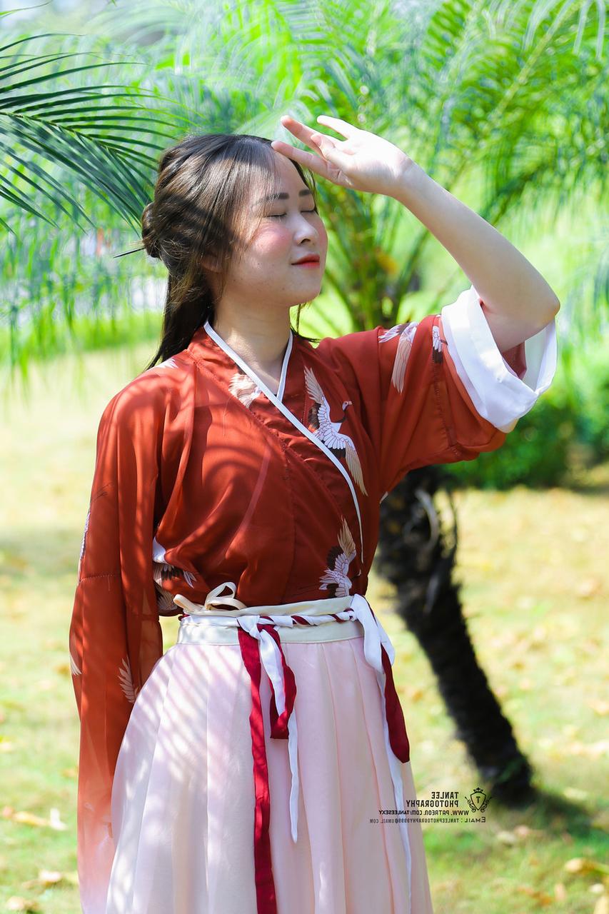 20P Glamorous Asian girl posing in her traditional Chinese outfit in nature