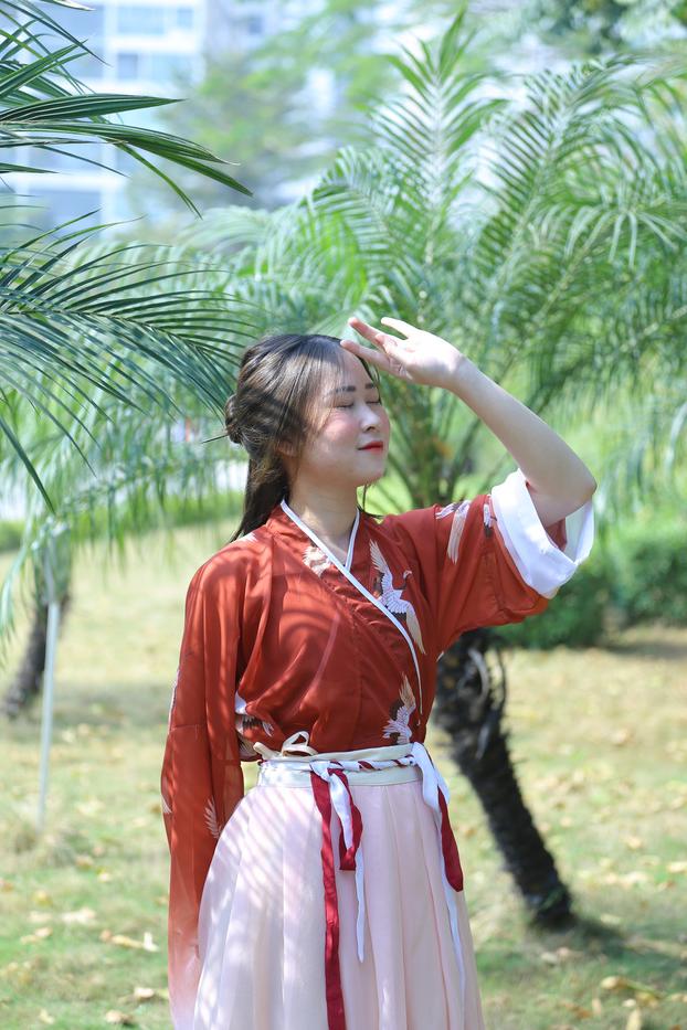 20P Glamorous Asian girl posing in her traditional Chinese outfit in nature
