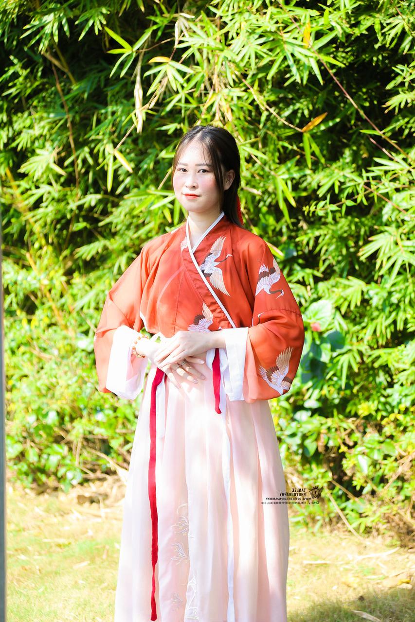 20P Glamorous Asian girl posing in her traditional Chinese outfit in nature