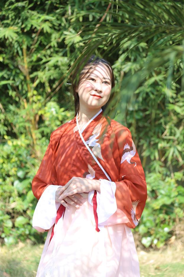 20P Glamorous Asian girl posing in her traditional Chinese outfit in nature