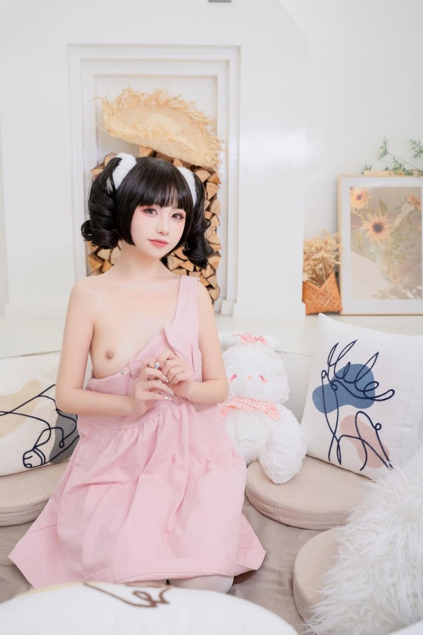 10P Pretty Asian babe shows her lovely teen tits while teasing in a sexy dress