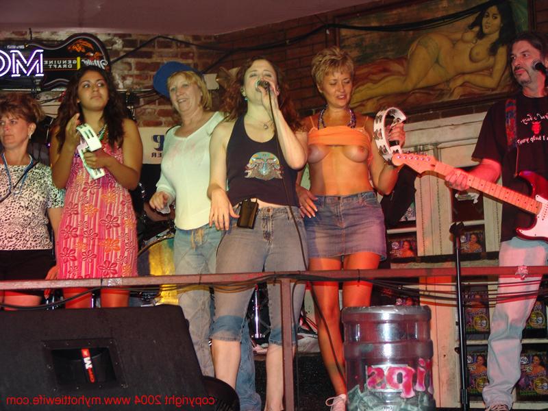20P Amateur swinger with big tits Tracy Lick exposes her attributes in a night bar