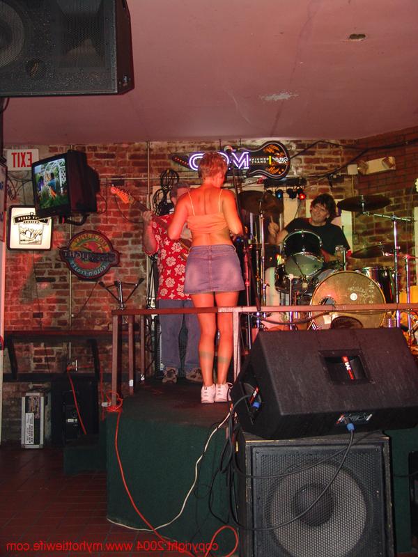 20P Amateur swinger with big tits Tracy Lick exposes her attributes in a night bar