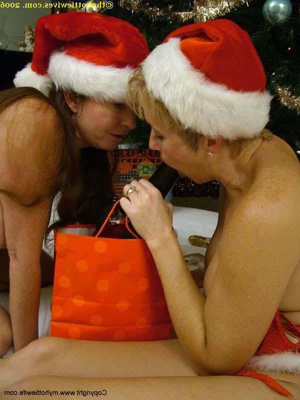20P Blonde & redheaded mom with big tits play with a strapon in Christmas outfits