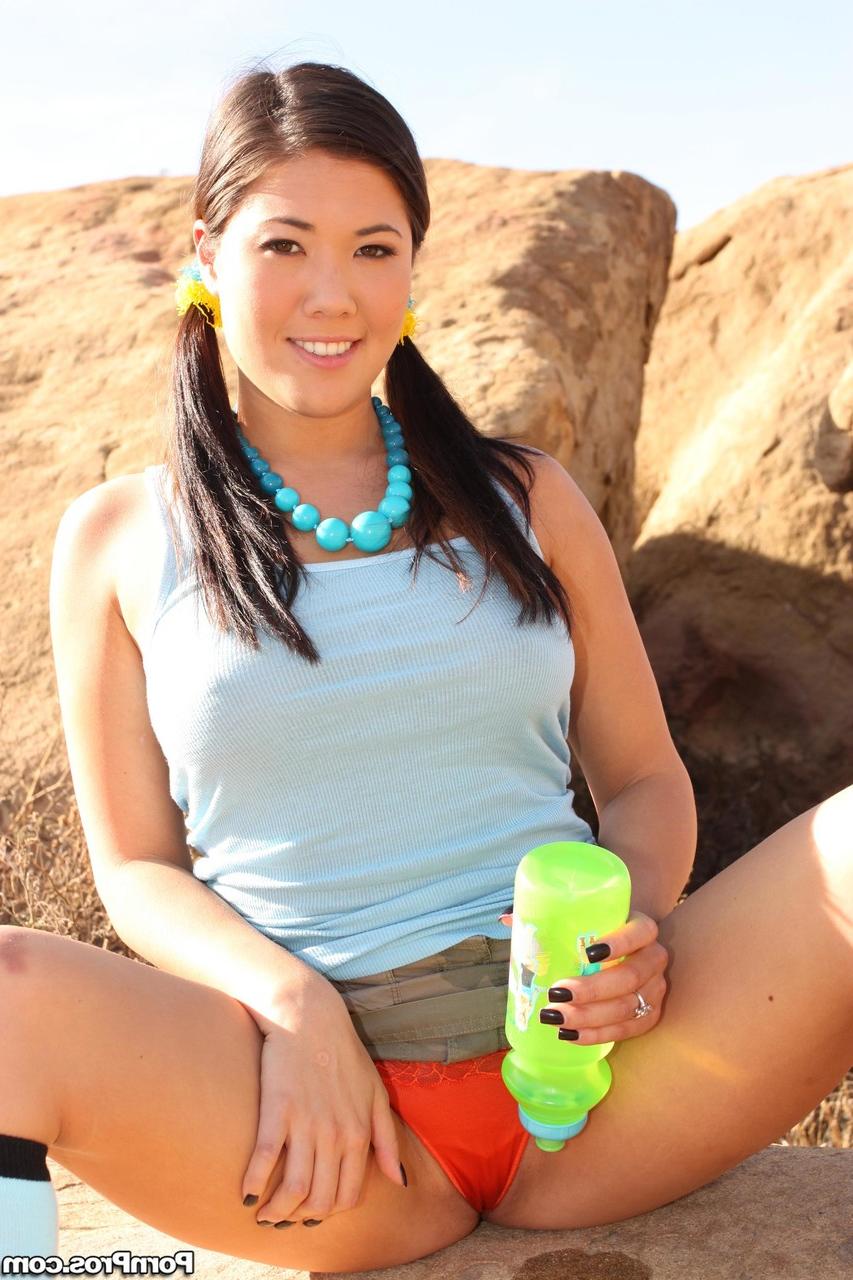 20P Pigtailed Asian hottie London Keyes suns big natural tits & flashes panties